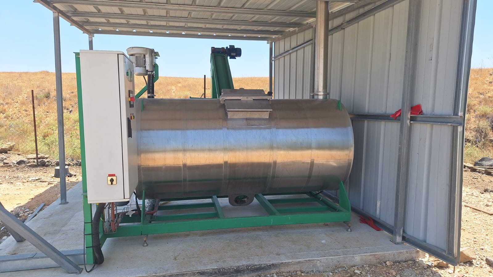 Protected field installation — 1500L system positioned beneath a purpose-built shelter